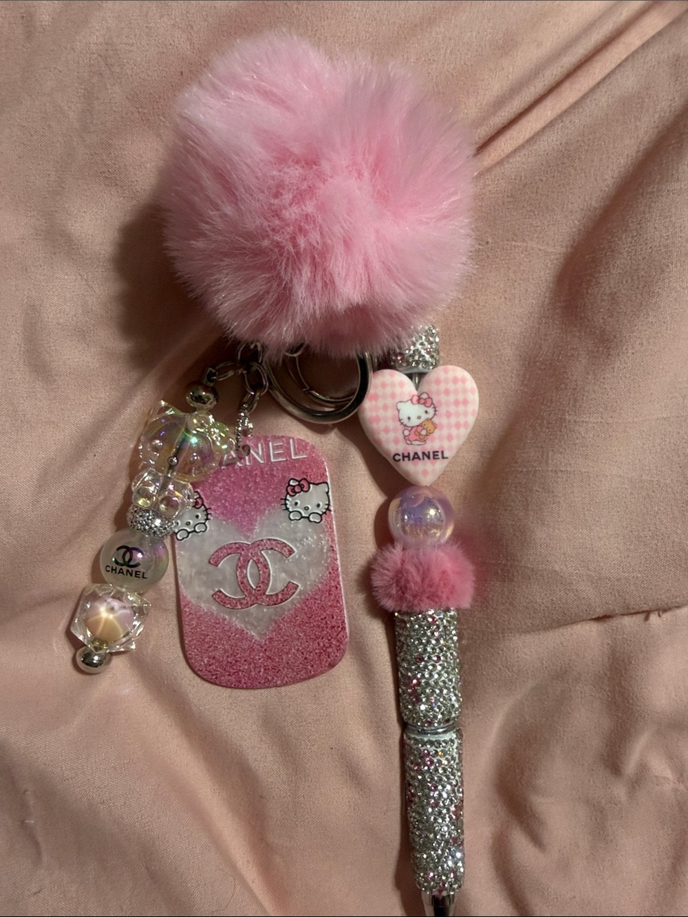 Pink matching keychain and rhinestone pen with extra pen refill.